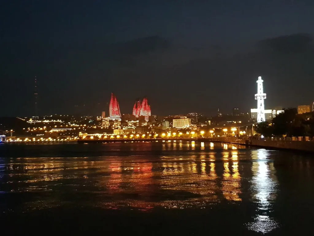 The Flame Towers lit red above Baku bay at night