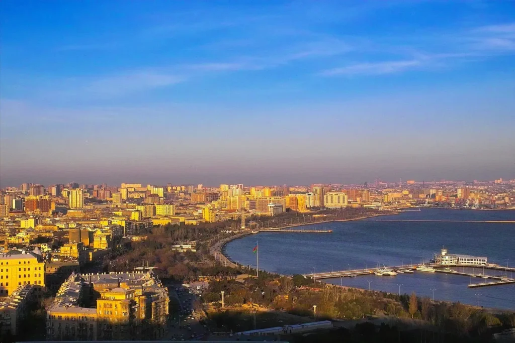 Baku and the bay in evening light seen from the hill above the city
