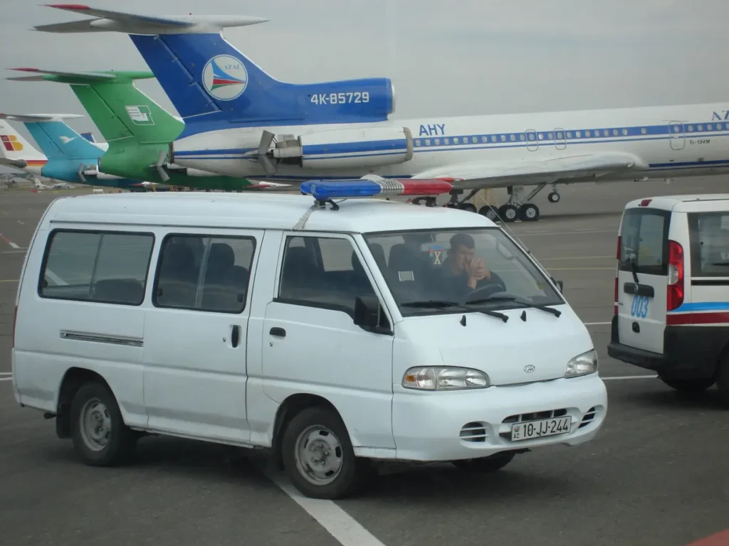 Ground vehicles and aircraft on the apron at Baku airport