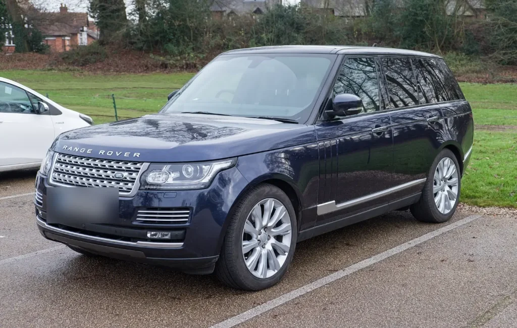 A dark blue Range Rover parked on a car park