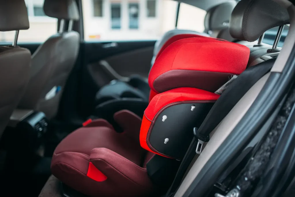 A child car seat fitted on the back seat